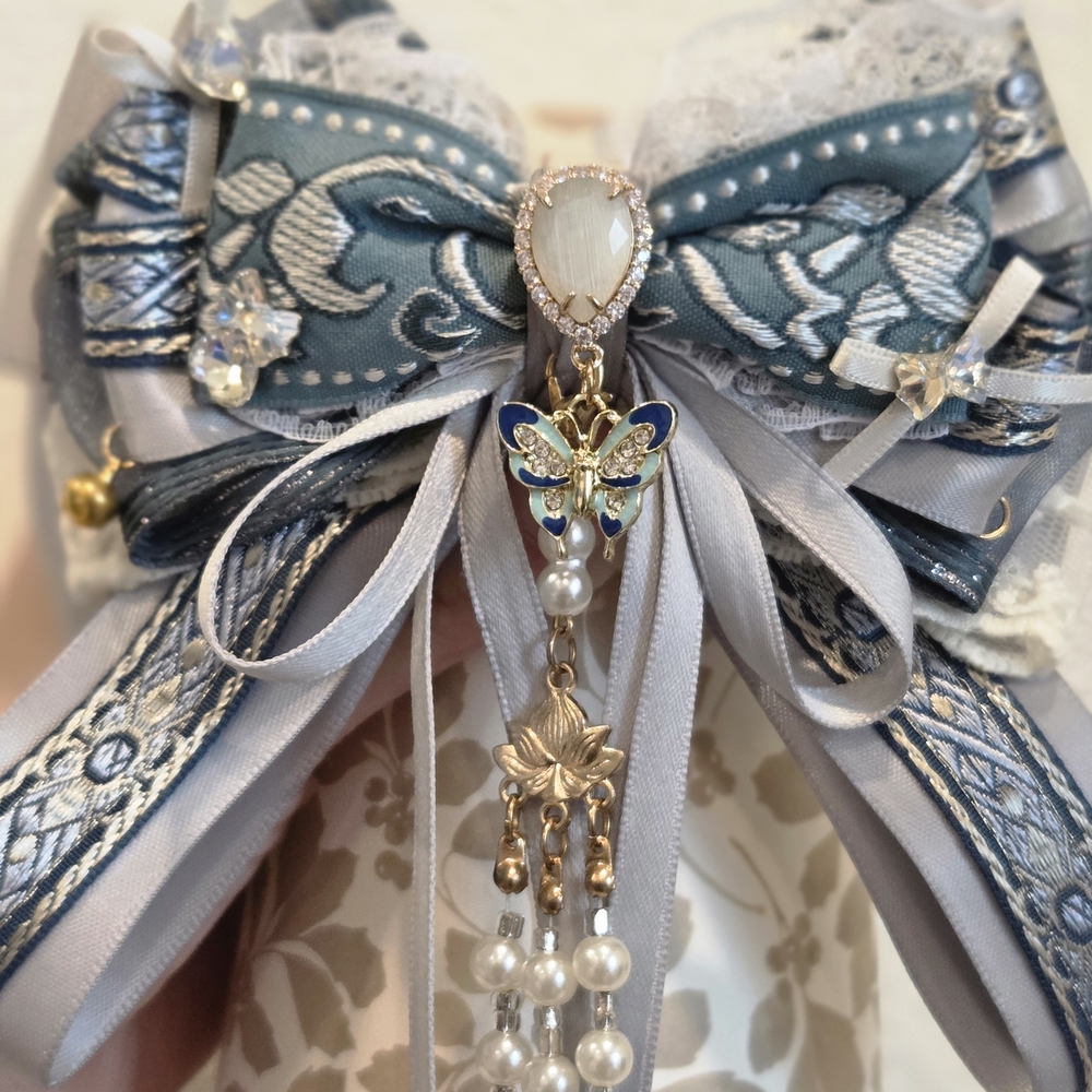 Elegant Blue and Silver Bow Brooch
